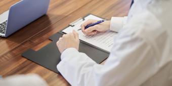 Med student sitting at desk with materials